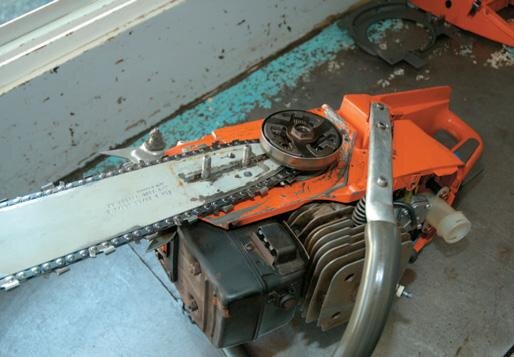 Sprocket, clutch and chain assembly