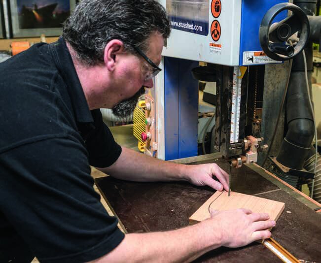 Rotate the piece of timber into the blade around the pivot point to cut a perfect circle