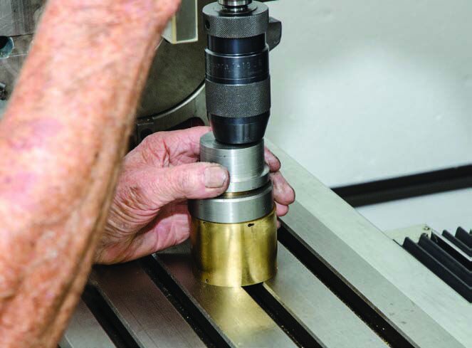 Pushing the spring into its barrel with the mill drill and custom-made die