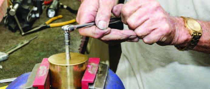 Winding the spring to engage the main spring hook