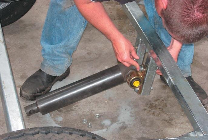 Hydraulic ram attached to sub-frame