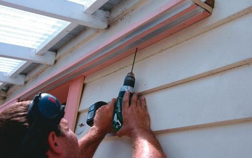 Door support screwed to batten