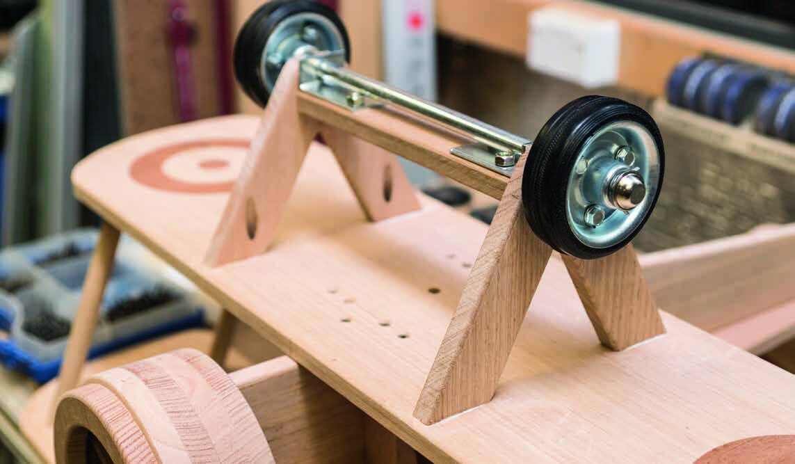 The brackets screwed to the undercarriage and the axle and wheels fitted