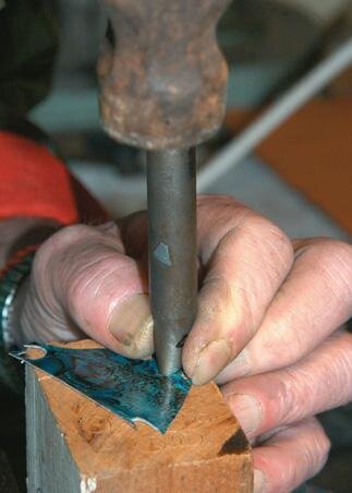 Wad punch paua veneer