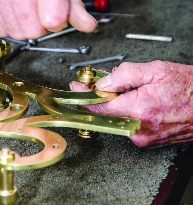 Attaching the clock face mounting bolt that can’t be placed after the barrel is positioned