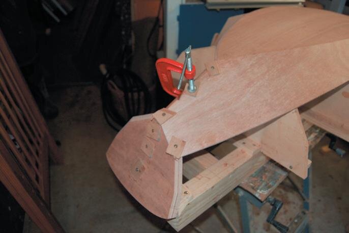Ply scrap protects from screw heads