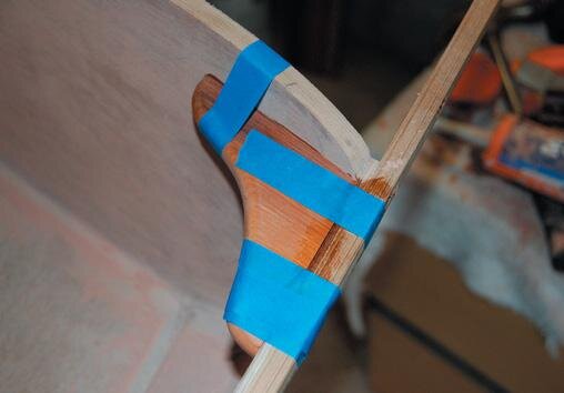 Knees taped while glue sets